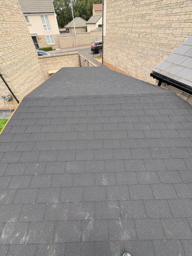Finished pitched pergola roof with grey shingles in Weston-Super-Mare.